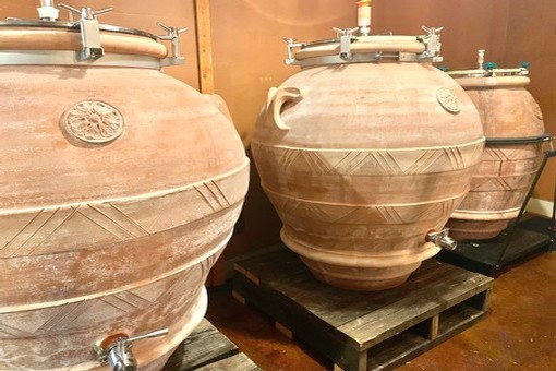 image of three terracotta wine casks
