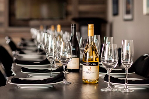 image of fancy table setting with table wear and wine glasses.