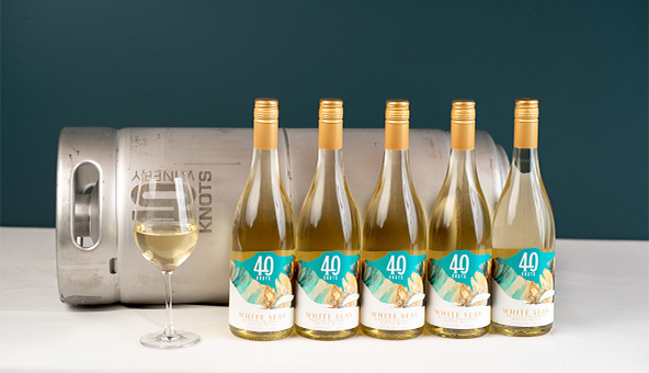 Bottles and keg of white wine