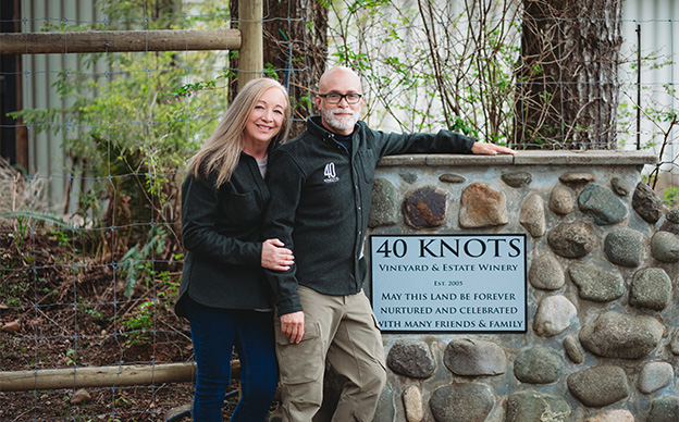 Owners Layne and Brenda at property entrance