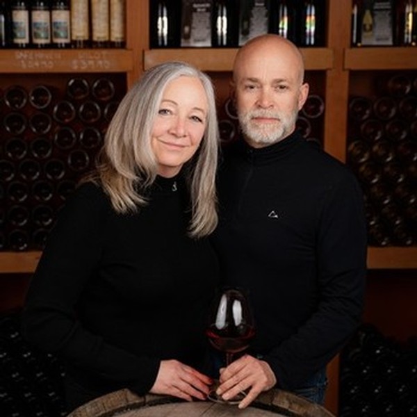 Image of Owners, Brenda and Layne in the wine cellar.