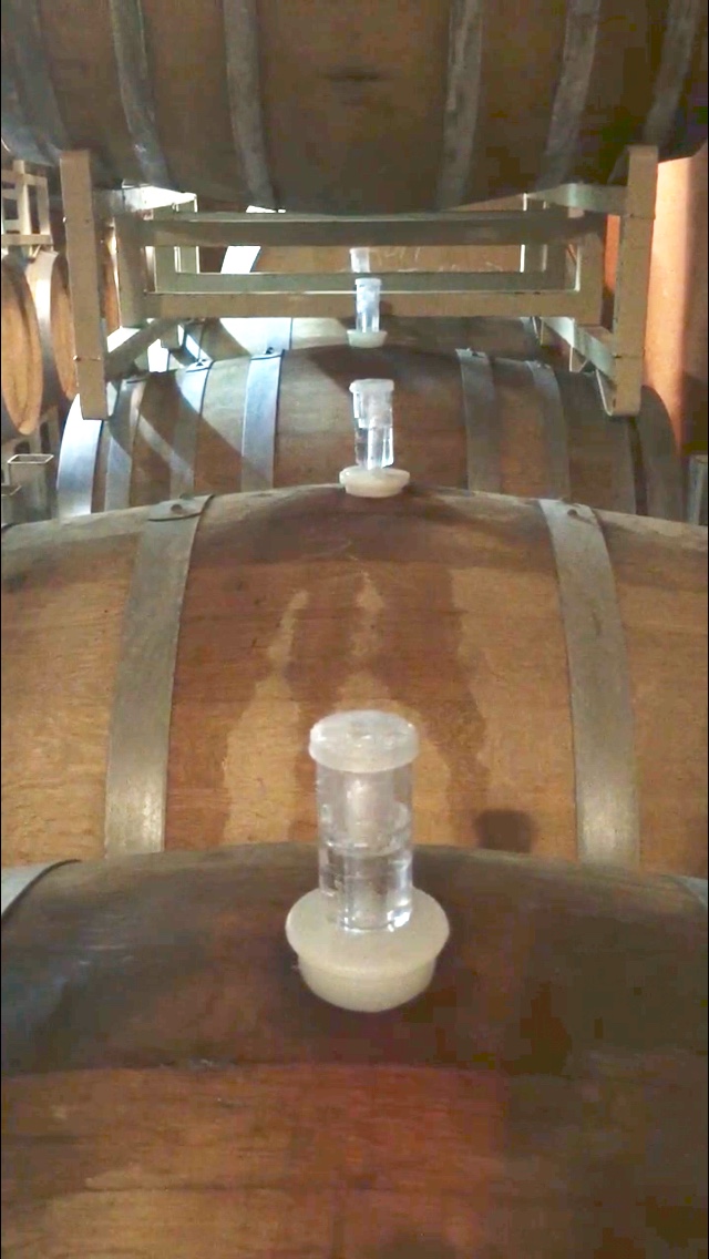 image of wooden wine kegs stacked two levels high.