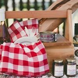 image of picnic basket with red and white table cloth.