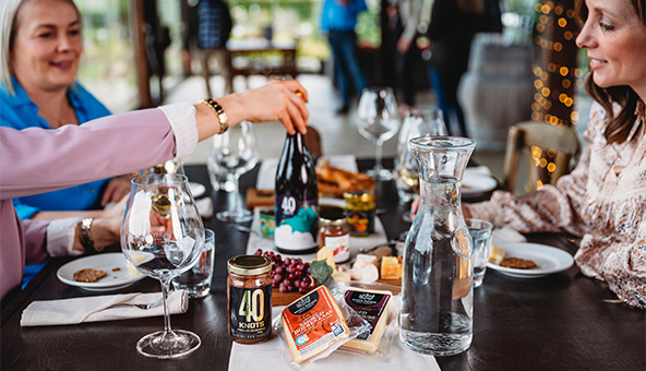 Women enjoying wine and food