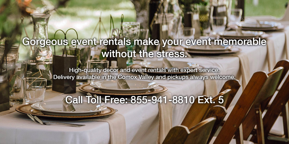 Image of a table and chairs with fancy place settings.